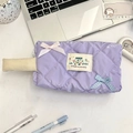 Macro view of purple quilted pencil case with white handle and cute bow accents - Light Purple Plaid
