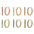 Elegant 12mm gold hoop earrings set with colorful zircon stones on white background - Gold Plated + Purple Zircon