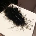 Luxurious black feather hair claw clip with crystal tassels and metallic chains - Black