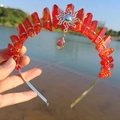 Detailed view of red crystal crown headband with silver sun charm and rainbow teardrop gem - Orange Red/Sun/AB Colorful Pendant