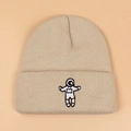 Gorro de punto de invierno beige con un elegante patrón de bordado de astronauta - Talla única / Beige