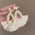 Detailed macro view of handmade cream straw woven fan tassel earrings with gold studs - 13# Steel Post - Gold - White
