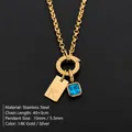 Collar de acero inoxidable chapado en oro de 14K con letra inicial K y cristal azul - Dorado / Letra K