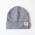 Grey knit baby beanie with embroidered smiley face patch on white background - One Size / Gray