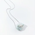 Close-up of irregular light blue natural raw crystal pendant with silver link chain - Amazonite