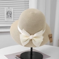 Detail of beige straw hat with white satin ribbon and UV CUT protective sun tag - Adjustable (57.5cm) / Beige