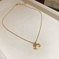 Collier avec pendentif cheval à bascule doré et chaîne à billes dans un écrin - Style Cheval à Bascule Doré