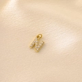 Macro detail of gold-plated letter N pendant featuring micro-paved cubic zirconia - Letter N / Gold