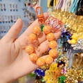 Handheld orange beaded phone charm with transparent bow and cute cartoon bear pendant - Orange