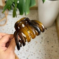 Close-up of large amber tortoiseshell hair claw clip with interlocking teeth design - Matte Tortoiseshell