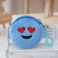 Detail of round blue plush coin purse with heart-eye emoji embroidery and clip - Light Blue