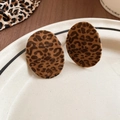 Macro shot of oval leopard print earrings with a velvet-textured finish on a white plate - Large Oval (Silver Needle-Coffee-Oval Shape)