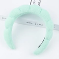 Thick mint green sponge headband with soft terry cloth texture and non-slip design - Cyan