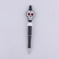 DIY Halloween beadable pen featuring a colorful candy skull and silicone beads - Skull
