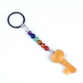 Healing chakra stone keychain with orange quartz heart-shaped key pendant on white background - Topaz