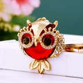 Golden owl keychain with large red crystal and diamond-studded wings for women - Gemstone Owl Red
