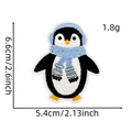 Close-up of penguin embroidery patch with dimensions 6.6cm by 5.4cm and weight 1.8g - Blue Christmas Patch 29# (Penguin)