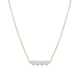 Close-up of four round pearls on a golden metal chain for an elegant minimalist look - Four Pearls Cluster Pendant