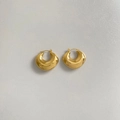 Detailed close-up of golden hollow oval stud earrings on white textured background - Gold U-Shape Style (DEK1813)