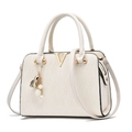 White embossed leather handbag with V-shaped gold hardware and pearl tassel charm - Off-white