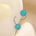 Macro view of crystal-encrusted blue Shamballa ball earring on a white ear model - Style 05 White Gold Tone F61 / Single Piece / Blue