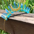 Close-up of blue crystal moon crown crown with handmade gold wire wrapping and crescent detail - Light Blue Crystal Gold Wire Gold Moon