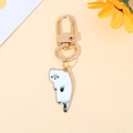 Cute white cat keychain with green enamel detail and golden metal lobster clasp - White Cat