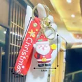 3D Santa Claus keychain with red PVC hand strap, gold bell, and dimensions 5.1x3.9cm - Smiling Santa Claus