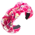 Detail of a pink knotted headband with iridescent sequins and white mesh fabric overlay - Minnie Style Sequin Knot Style / Rose Red
