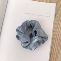 Fog blue laser organza scrunchie with metallic luster on white minimalist background - Pearly Satin Grey