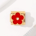 Macro shot of gold stainless steel clover module with red flower and clear gemstone - 2038 - Red Five-petal Flower With Diamonds All Gold