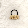 Golden hollowed hair tie with irregular texture on black elastic band for women - Gold Irregular Liquid 5cm