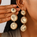 Elegant gold layered petal drop earrings with radial texture on a female model - Three-Layer Petal Radial Gold (A-415)