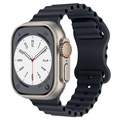 Detailed close-up of a black wavy silicone ocean strap on a metallic sports smartwatch - Midnight