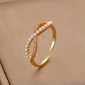 Detailed side view of an infinity pearl ring with gold plating and cubic zirconia accents - Gold Infinity Pearl Open Ring (5355)