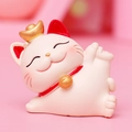 Pink and white Maneki Neko lucky cat figurine with gold ingot for home and car decor - Side Lying Raising Leg