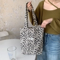 Detail of leopard print canvas tote bag styled with casual knitwear and blue jeans - Off-white Small
