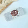 Light blue pleated cotton shawl with handmade paper sleeve on a soft blue background - Style #31