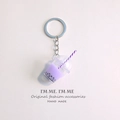 Detailed close-up of a purple bubble tea keychain with miniature straw and black pearls - Taro