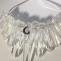 Detail of clear raw crystals hand-wrapped with silver wire and moon star pendants - White Crystal + Small Moon