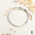 Detail of beaded necklace featuring marble texture beads and golden lobster clasp closure - White Turquoise