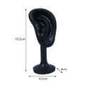 Matte black ear-shaped earring display stand with dimension labels and stable base - Black
