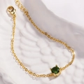 Detail view of gold-plated bracelet featuring a claw-set round green gemstone - Olive Green Zirconia (Round Olive)