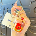 Cute liquid quicksand keychain featuring red lucky bag and golden metal lobster clasp - Liquid Lucky Bag (Gas Tank Shape)