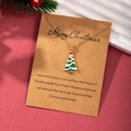 Golden Christmas tree necklace with green enamel pendant on a festive gift card - Christmas Tree