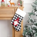 Black and white plaid Christmas stocking with Santa embroidery hanging by fireplace - Black White Plaid Rudolf