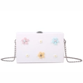White box-style crossbody bag featuring 3D floral embellishments and silver chain - White