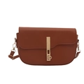 Brown faux leather saddle bag with golden clasp closure and shoulder strap on white background - Brown