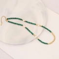 Beaded necklace with green cylindrical stones, white pearls and gold extension chain - Malachite