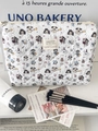 Detail van de gewatteerde katoenen make-uptas met schattige hondenprints en een ritssluiting - Platte clutch tas